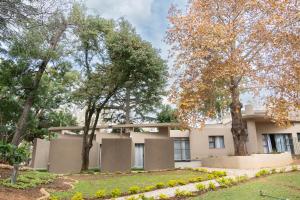 a building with trees in front of it at 157 on North-Sandton in Johannesburg