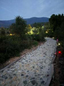 a rocky road with rocks on it at night at Quinta-lina de serpins in Serpins
