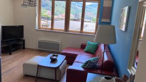a living room with a couch and a table at Downtown Apartment in Kotor
