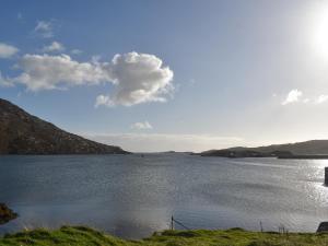 a view of a large body of water at Lochboisdale Cottage in Lochboisdale +19 photos