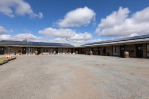 a large building with a lot of solar panels on it at The Argent Motel in Broken Hill