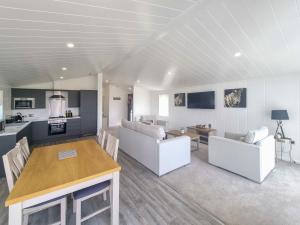 a kitchen and living room with a table and chairs at Cherry Blossom 40 - Uk50709 in Garton
