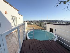 a small swimming pool on the balcony of a house at villa piscina y vistas espectaculares a la montana , gran terraza y aire acondicionado in Cuevas del Almanzora