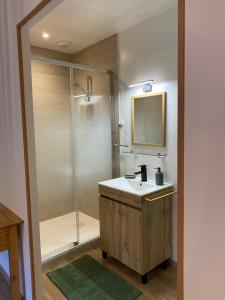 a bathroom with a sink and a shower at Du Baume Au Cœur in Baume-les-Messieurs +21 photos