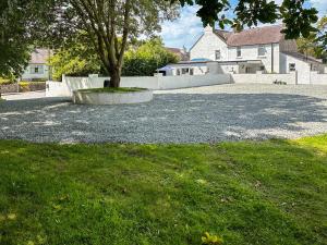 a skate park with a tree and a skateboard ramp at The White Anchor in Newborough