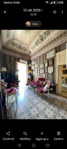 a page of a living room with tables and chairs at Casato Lioy in Ripacandida