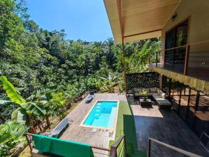 an aerial view of a house with a swimming pool at Stays at Corcovado Nature Villas in Puerto Jiménez