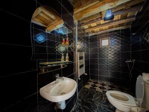 a bathroom with a sink and a toilet at Tonaroz House in Imlil +63 photos