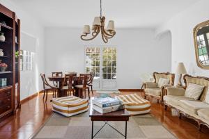 a living room with a couch and a table at Casa MiRaMar in Mosteiros
