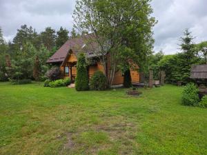 a house with a yard in front of it at Gorczyca Reset in Płaska