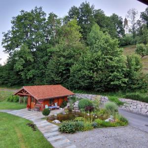 a small house with a garden in the yard at Haus Leblhuber in Windischgarsten +42 photos