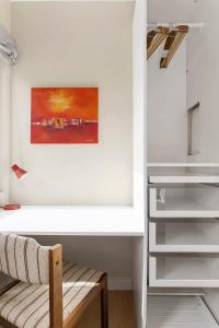 a room with a bench and a painting on the wall at 5BR 2Bath Frogner - Parking - Vigelandsparken in Oslo +14 photos