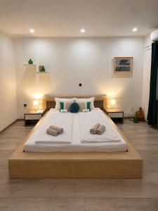 a large bed with two pillows on it in a room at Holiday house Marea in Bribir +39 photos