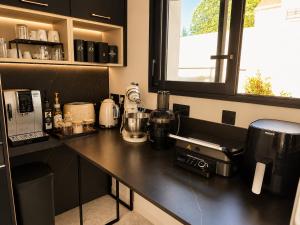 a kitchen with a counter top with a appliance on it at Contemporary villa between Paris and Disneyland in Champs-sur-Marne
