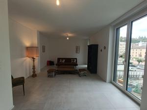 a living room with a couch and a window at Paradise 31 in Paradiso