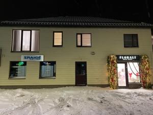 a house with christmas wreaths in front of it at Florina namai 2 in Marijampolė