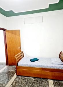 a bedroom with a bed with a book on it at Casa Verde in Limeira