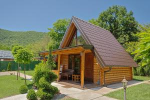 a log cabin with a pitched roof at Sicevacka Bajka log cabin in a nature park in Niš