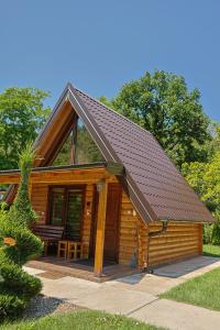 a log cabin with a pitched roof at Sicevacka Bajka log cabin in a nature park in Niš
