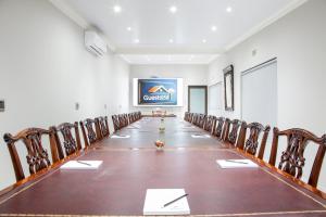an empty conference room with chairs and a board at Guest at 58 in Lydenburg