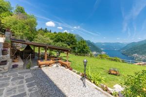 a house with a view of a lake at Incanto del Lago Country House in Faggeto Lario 