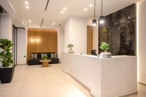 a lobby of a hospital with a reception counter at Anesea City in Heraklion