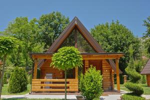 a log cabin with a pitched roof at Sicevacka Bajka log cabin in a nature park in Niš