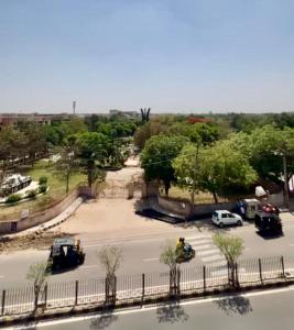 a view of a parking lot with vehicles parked at The Arte in Rohtak