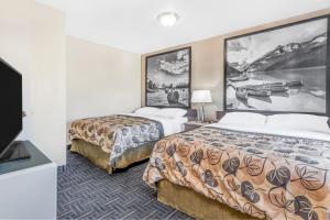 Voodi või voodid majutusasutuse Super 8 by Wyndham Stettler toas
