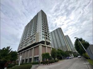 a tall building on a city street with a sky at lumpini naklua wongamat in North Pattaya