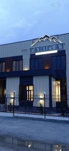 a building with a sign on top of it at Tabigat Hotel & Spa in Alga +1 photo