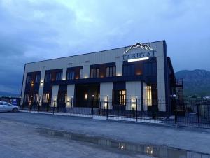 a building with a sign on the side of it at Tabigat Hotel & Spa in Alga