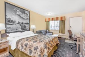 Voodi või voodid majutusasutuse Super 8 by Wyndham Stettler toas