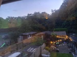an aerial view of a yard with a house with lights at Strawberry dream 2 in Newcastle upon Tyne