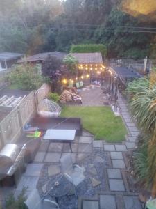 an aerial view of a backyard with a bench and lights at Strawberry dream 2 in Newcastle upon Tyne