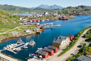 an aerial view of a harbor with boats in the water at High standard Lodge Ballstad in Ballstad