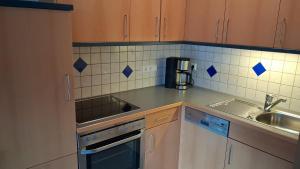 a kitchen with a sink and a counter top at Merlschober, Ferienwohnung 3, Ossiacher See in Ossiach