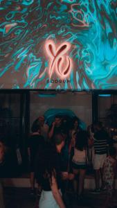 a group of people standing in a room at a party at YU Townhouse in Bodrum City