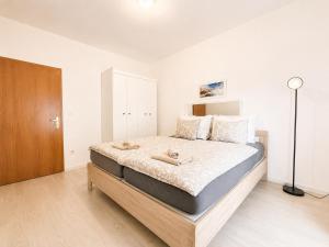 a bedroom with a large bed in a room at Casa Sol Maris in Novigrad Istria