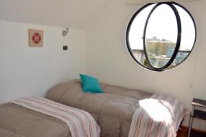 Rúm í herbergi á B&B Hostel CasaMoro
