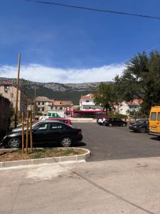 a parking lot with cars parked in a parking lot at Katarina in Kaštela