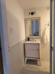 a bathroom with a sink and a mirror at La Preta, casa de campo in San Clemente +24 photos