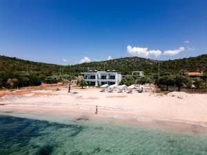 an aerial view of a beach with a house at EluDes Seaside Suites in Astris