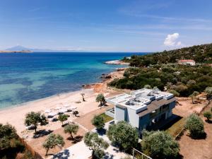 an aerial view of a house on a beach at EluDes Seaside Suites in Astris