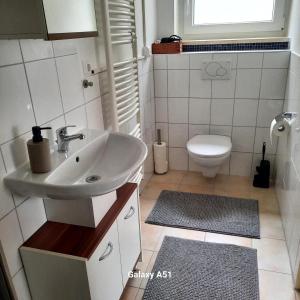 a bathroom with a sink and a toilet at Haus Broni in Prem +6 photos
