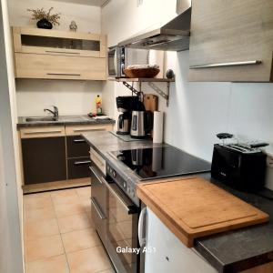 a small kitchen with a stove and a sink at Haus Broni in Prem