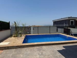 a swimming pool on the roof of a building at Villa Gaia in Selçuk