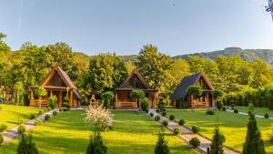 a home in the mountains with a green yard at Sicevacka Bajka log cabin in a nature park in Niš +79 photos