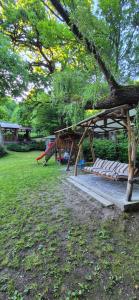 a park with a picnic table and a tree at Feher Cabana in Sovata