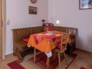 a dining room table with a colorful table cloth on it at Terrassenwohnung, Herrischried in Herrischried
